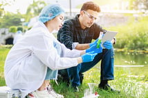 Researchers in the field examining samples